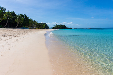 Beautiful beach on a sunny day in Boracay Island in the Philippines.  Travel and holiday.