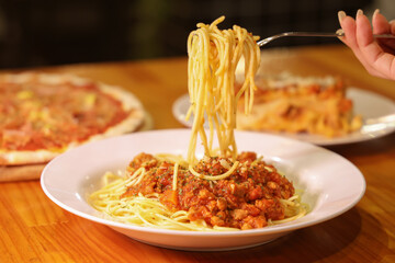 Pasta Delight: A culinary delight of spaghetti with rich sauce, meticulously prepared on a pristine...