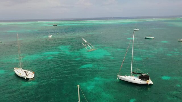 Aerial view of shipwrecked sailboat in St Croix Virgin Islands USVI harbor shot with drone