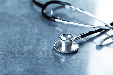 Black stethoscope for doctor diagnostic coronavirus disease, medical tool for health on blue...