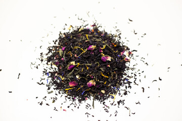 Black tea with rose petals. On a white background.