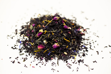 Black tea with rose petals. On a white background.