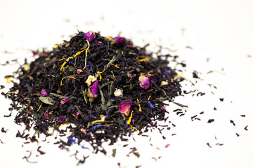 Black tea with rose petals. On a white background.