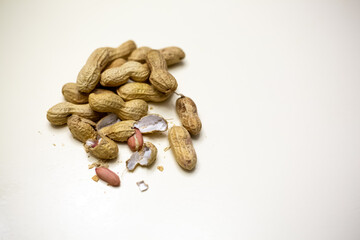 Peanuts. Peeled walnuts isolated on white background. Peanut macro.