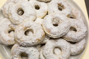 Homemade powdered sugar donuts. Background texture
