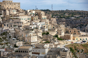 Obraz premium View of the Sassi di Matera a historic district in the city of Matera, well-known for their ancient cave dwellings. Basilicata. Italy