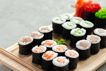 Maki sushi set served on wooden tray © fotofabrika