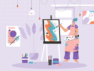 Woman painter drawing picture on canvas at easel