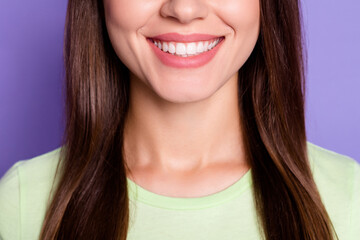 Closeup cropped photo of beautiful woman with brunette hair smiling with white teeth isolated on bright violet color background