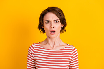 Close up portrait of attractive person in bad mood disbelief open mouth isolated on bright yellow...
