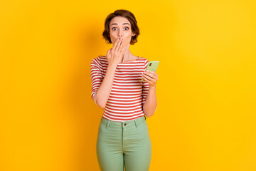 Photo of attractive person arm covering mouth made mistake bad news isolated on bright yellow color background