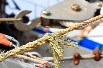 old and rusty pulley ropes of a fishing boat