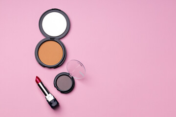 Set of decorative cosmetics on pink background