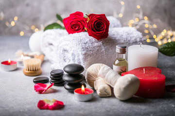 Fototapeta na wymiar Wellness decoration, spa massage setting, oil on stone background. Valentine's Day Zen and relax concept.