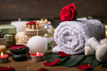 Plakat Wellness decoration, spa massage setting, oil on wooden background. Valentine's Day Zen and relax concept.