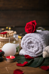 Naklejka na ściany i meble Wellness decoration, spa massage setting, oil on wooden background. Valentine's Day Zen and relax concept.