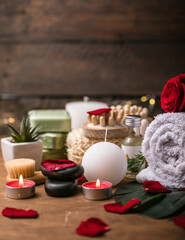Wellness decoration, spa massage setting,  oil on wooden background. Valentine's Day Zen and relax concept.