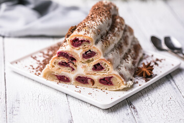 Сake monastery hut on white plate. Christmas dessert