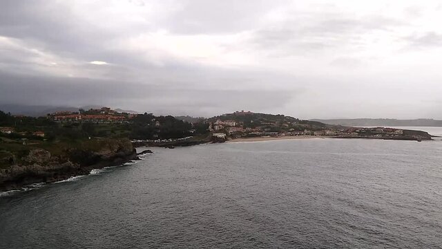 Scape of the village of Comillas under a cloudy sky, Cantabria, Spain