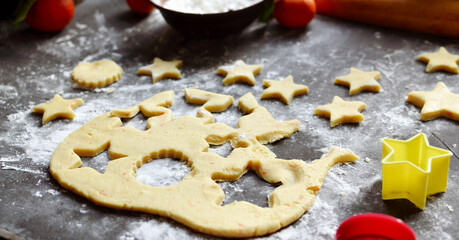 Cooking cookies for the new year and christmas. Flour and dough, cookie cutters. Top view. Copy space