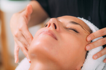 Obraz na płótnie Canvas Ayurvedic Face Massage Therapy with Essential Aromatherapy Oils