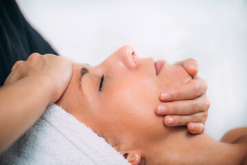 Fototapeta na wymiar Ayurvedic Face Massage Therapy with Essential Aromatherapy Oils