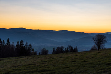 Moravskoslezske Beskydy mountain rqange from Bahenec in Slezske Beskydy mountains in Czech republic after sunset
