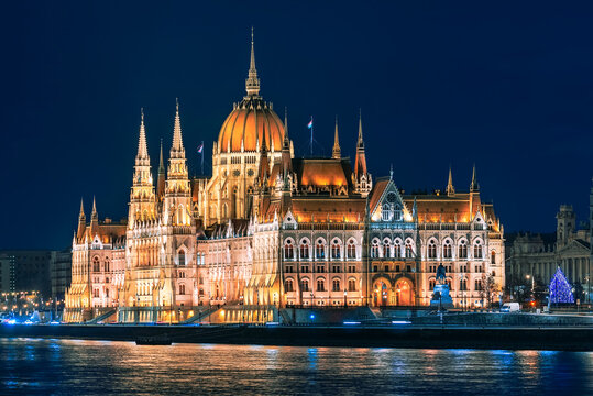 Hungarian parliament building at cristmas time. Amazing aerial view about the Hungaria government's building with giant christmas tree. The Government of Hungary's working here.
