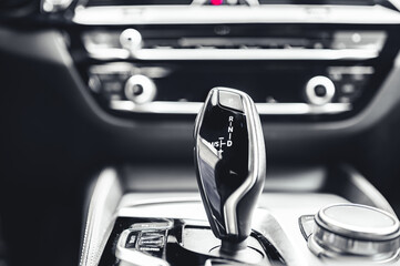 Luxury modern car interior. Automatic gearbox lever; Automatic transmission gearshift stick....