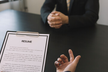 job interview in office, focus on resume writing tips, employer reviewing good cv of prepared skilled applicant, recruiter considering application, hr manager making hiring decision
