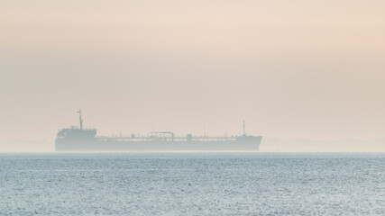 Oil tanker in foggy sea