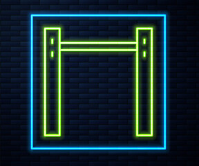 Glowing neon line Sport horizontal bar icon isolated on brick wall background. Vector.