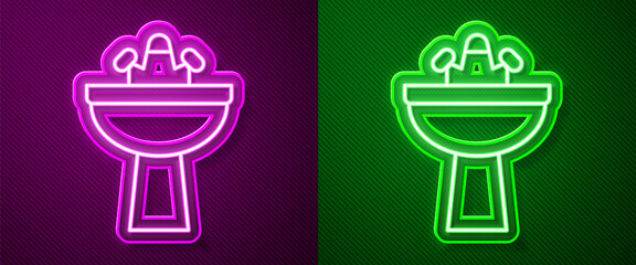 Glowing neon line Washbasin with water tap icon isolated on purple and green background. Vector.