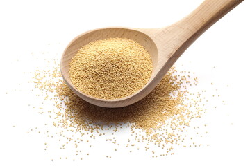 Amaranth seed pile in wooden spoon isolated on white background