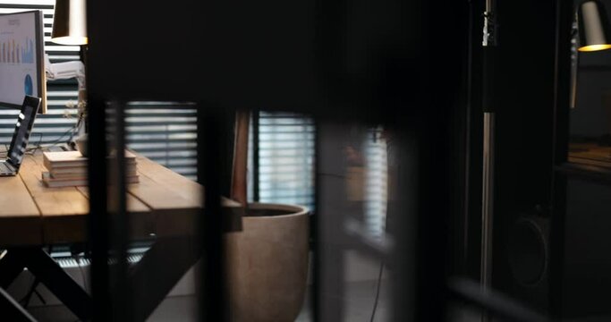 Young woman typing some text on a laptop, having gret idea while working in a cozy and style home office. Pan shot. Stay home and happy working online from home concept