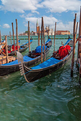 Fototapeta na wymiar Gondola on the background of the island of San Giorgio Maggiore in Venice (Italy)