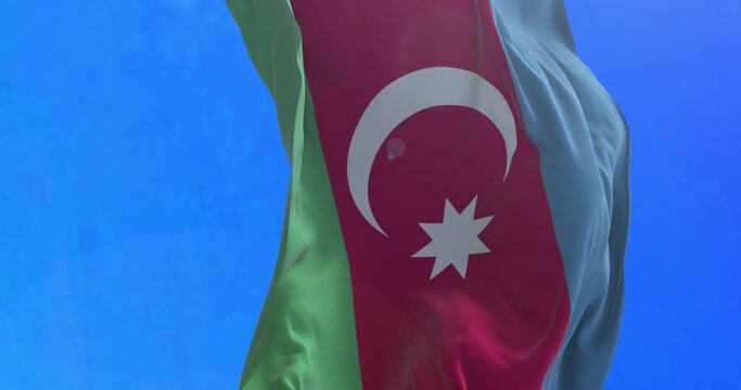 The national flag of the Republic of Azerbaijan is a horizontal tricolour featuring three equally sized fesses of bright blue, red, and green, with a white crescent and an eight-pointed star in the ce