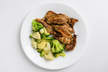 Grilled broccoli, cauliflower and chicken breast