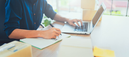 Businessman signing a document working on desk in office