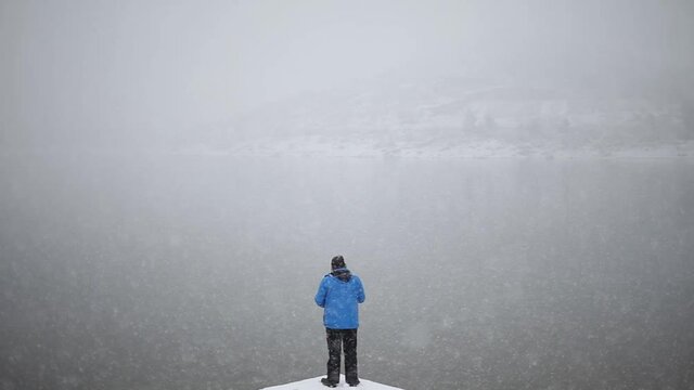 Loner freezing in the chilly cold winter of Navacerrada alps Spain