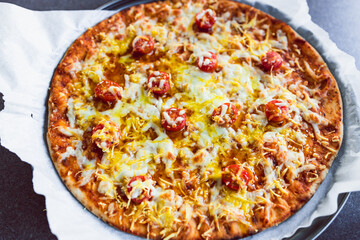 plant-based food, vegan flatbread pizza with cherry tomatoes and dairy-free cheese