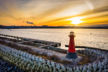 The lighthouse at the exit to the Baltic Sea in New Port at sunset, Gdansk. Poland