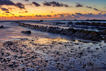 Barrika wild beach at sunset, Biscay, Basque Country, Spain.