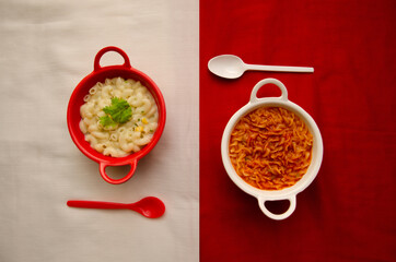 White Pasta in Red colored bowl on White background and Red Pasta in White colored bowl on Red background
