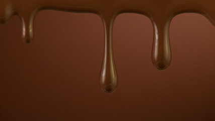 Pouring dark hot chocolate on brown gradient background.