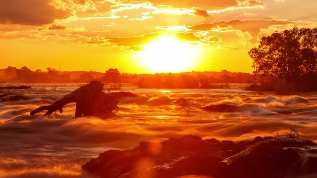 Time lapse of the sun setting on the beautiful Victoria Falls on the border of Zambia and Zimbabwe.