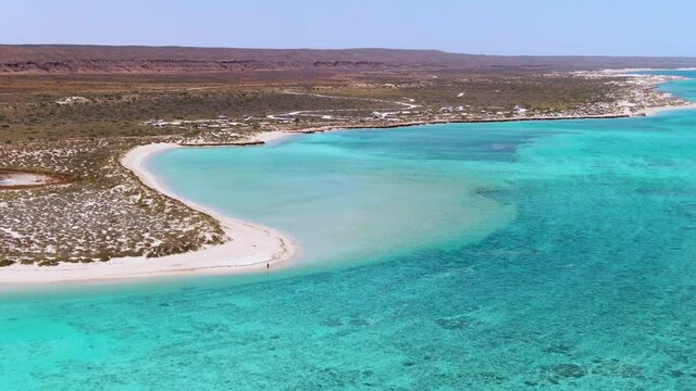 Aerial Sandy bay beach in Ningaloo reef near Exmouth in Western Australia. WA Tourism, recreation and camping concepts.