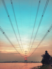 power lines sunset at lake