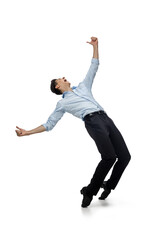 Dance king. Happy young man dancing in casual clothes or suit, remaking legendary moves and dances of celebrity from culture history. Isolated on white. Action, motion, fame concept. Creative