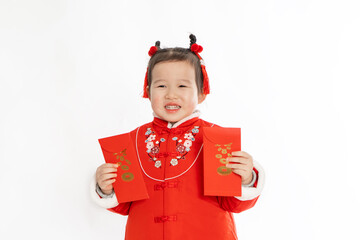 A little girl in traditional Chinese dress holds a new year's red envelope in her hand
